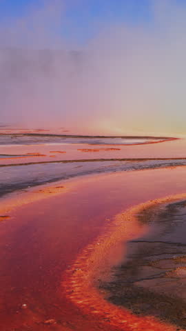 Explore the stunning and vibrant hues found in Yellowstone National Park, a true showcase of natures extraordinary artistry amidst Wyomings magnificent geothermal wonders and unique landscapes
