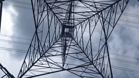 electric transmission steel pole tower. Green and renewable energy sustainability concept. Tilting down, transmission tower, rotate footage - Powered by Shutterstock - Get 15% off with code: PIKWIZARD15