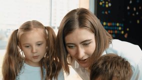 Caucasian teacher looking at african learner work or presentation. Group of diverse student looking at presentation while learning about coding and programing data at STEM technology class. Erudition. - Powered by Shutterstock - Get 15% off with code: PIKWIZARD15