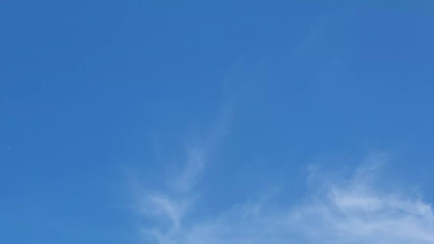 Beautiful 4K clear blue sky with misty clouds ideal for nature backdrops, motivation and mediation backgrounds, peaceful scene concept. ideal for weather news backgrounds.