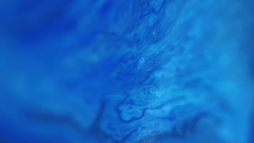 Blur ink. Acrylic fluid. Defocused blue color emulsion liquid splatter blend flow motion grain texture abstract art background.