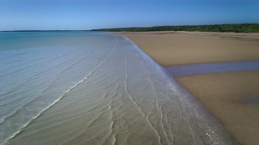 Aerial footage of mudflats Cungulla Beach, Townsville, North Queensland, Australia.