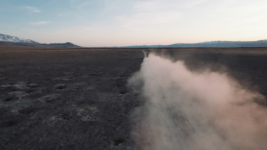 4K Aerial SUV Offroad adventure desert high speed follow dust trail
