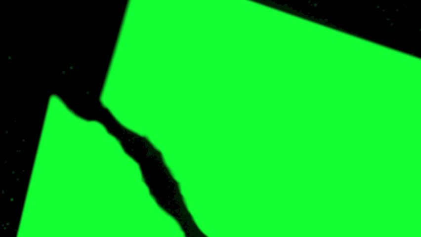 Shattered green glass fragments breaking apart with chroma key, ideal for transitions, motion graphics, or dynamic video effects