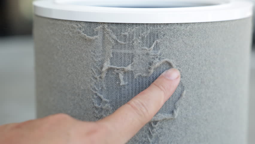 PM 2.5 dusty air purifier filter, Dirty air purifier filter covered in dust, showing air pollution and the need for cleaning or replacement to maintain clean air.4k resolution.