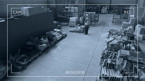 Wide high-angle CCTV security camera shot of male employees in hardhats and visibility vests working in spacious warehouse, transporting boxes on hydraulic trolley checking pallets - Powered by Shutterstock - Get 15% off with code: PIKWIZARD15
