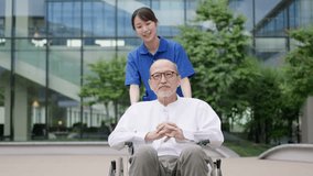 Elderly people in wheelchairs taking a walk with their caregivers - Powered by Shutterstock - Get 15% off with code: PIKWIZARD15