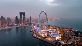Aerial view of Ain Dubai ferris wheel illuminated at night on Bluewaters Island in Dubai Marina - Powered by Shutterstock - Get 15% off with code: PIKWIZARD15