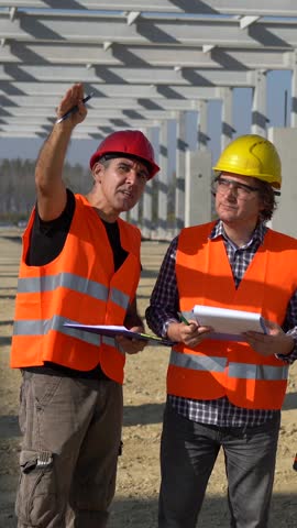 Construction Project Team Meeting at Future Factory Construction Site. Project Manager, Female Lead Architect, Construction Foreman and Supervisor Discuss a Project. Gender Equality at Work.