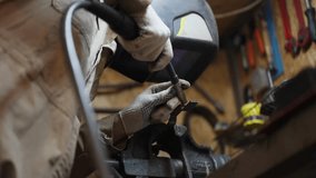 Professional welder man in the metalwork factory welding metal he wearing safety equipment and helmet the sparkles fly everywhere - Powered by Shutterstock - Get 15% off with code: PIKWIZARD15