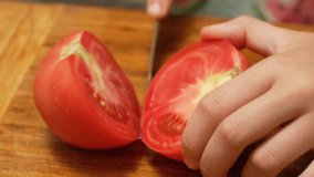 Cutting a Tomato on a Wooden Board - Powered by Shutterstock - Get 15% off with code: PIKWIZARD15