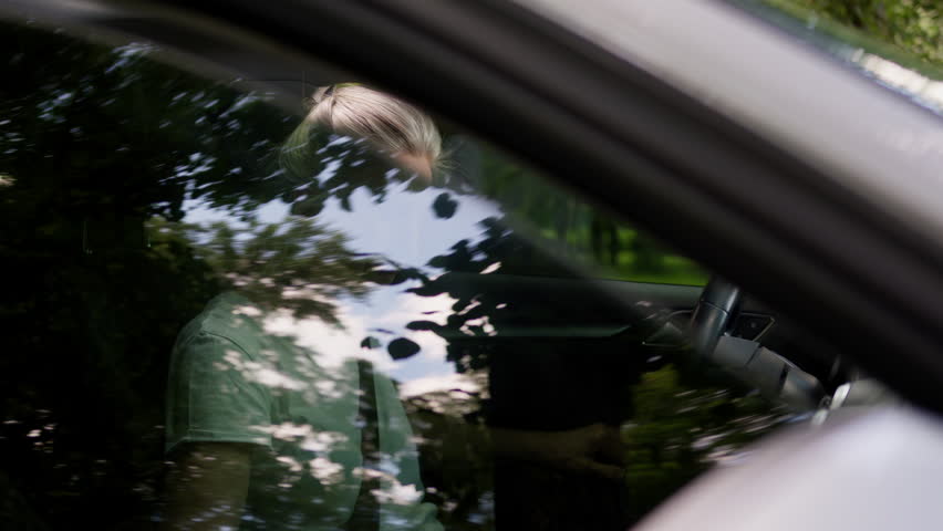 Unhealthy stressed annoyed Caucasian mature senior woman elderly female grandmother automobile driver opening car windows to cool air conditioner suffering heat sweat hot warm weather inside transport