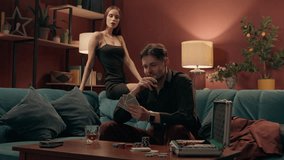 Happy Caucasian elegant playful couple enjoy playing poker cards game lucky rich man male guy winning bet competition stack chips tokens excited woman female girl in dress applauding gambling at home - Powered by Shutterstock - Get 15% off with code: PIKWIZARD15