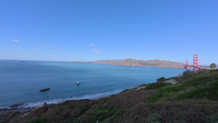 Timelapse of a cargo ship entering the San Francisco Bay from the Pacific Ocean under the Golden Gate Bridge in California, USA