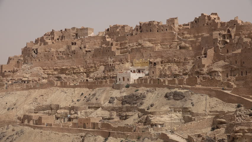Overview of partly abandoned Berber village of Chenini, located on a rugged mountain ridge in Tunisia
