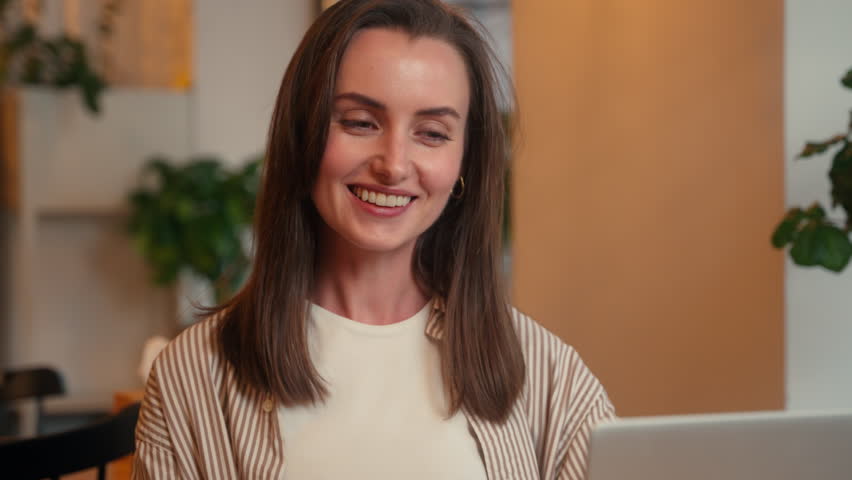 Caucasian happy smiling positive carefree woman businesswoman female business girl talking video call conversation conference communicate laptop online internet computer work in cafe indoors interview - Powered by Shutterstock - Get 15% off with code: PIKWIZARD15