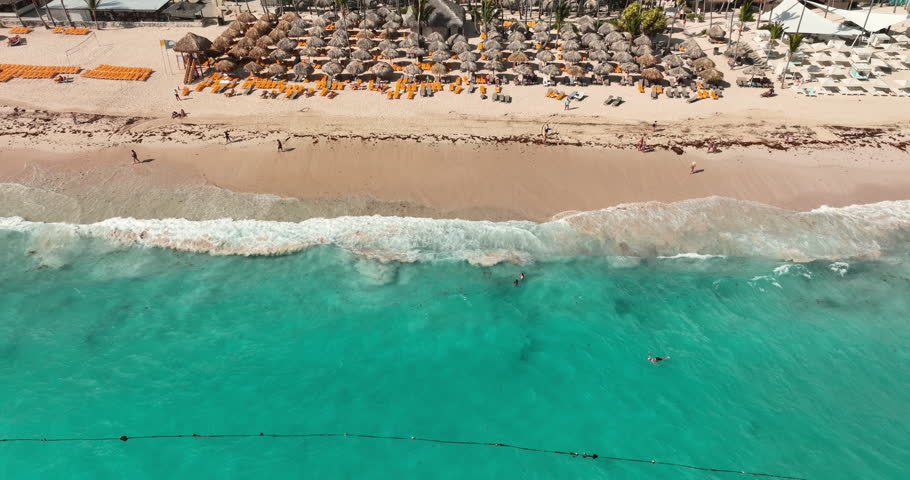 Aerial panorama landscape of tropical resort Bavaro, Punta Cana, Dominican Republic, sunrise over caribbean sea, coastline with umbrellas and loungers and hotel pools and villas