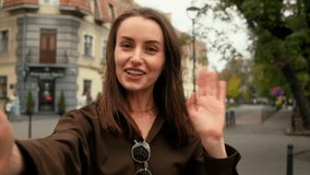 Webcam view selfie holding mobile phone record video recording blog vlog influence smiling talking video call conference talk chat Caucasian woman girl female lady walking in city outdoor go outdoors - Powered by Shutterstock - Get 15% off with code: PIKWIZARD15