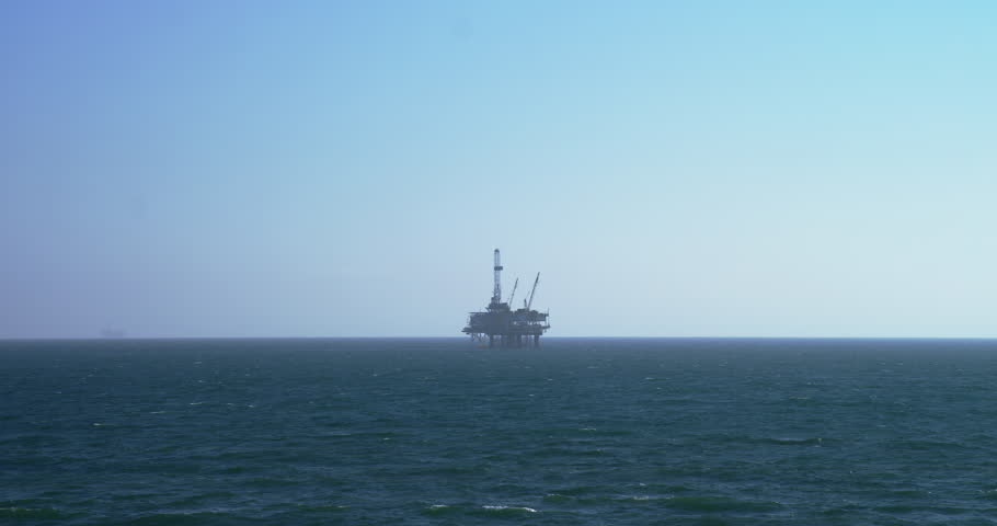 Huntington Beach California, Oil derrick, beach view, blue sky, mist, ocean