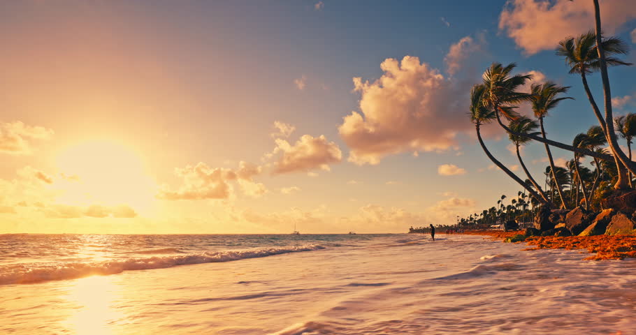 Sunrise over ocean and paradise tropical island landscape. Tropical caribbean summer vacation Bavaro Beach, Punta Cana resort, Dominican Republic