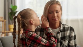 Shocked Caucasian female mother woman listening family kid daughter whisper gossip at home smiling child little schoolgirl sharing secret with lady mom parent girl talking rumour funny story custody - Powered by Shutterstock - Get 15% off with code: PIKWIZARD15