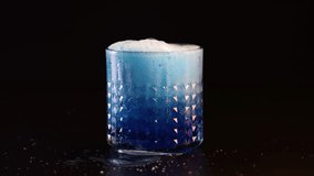 Blue liquid poured into glass, creating foam - Powered by Shutterstock - Get 15% off with code: PIKWIZARD15