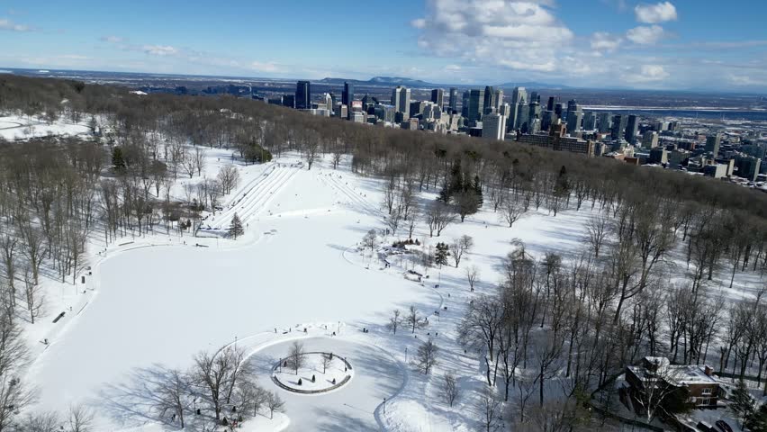 View of the skating rink and downtown in winter from Mont Royal, Montreal. Quebec, Canada