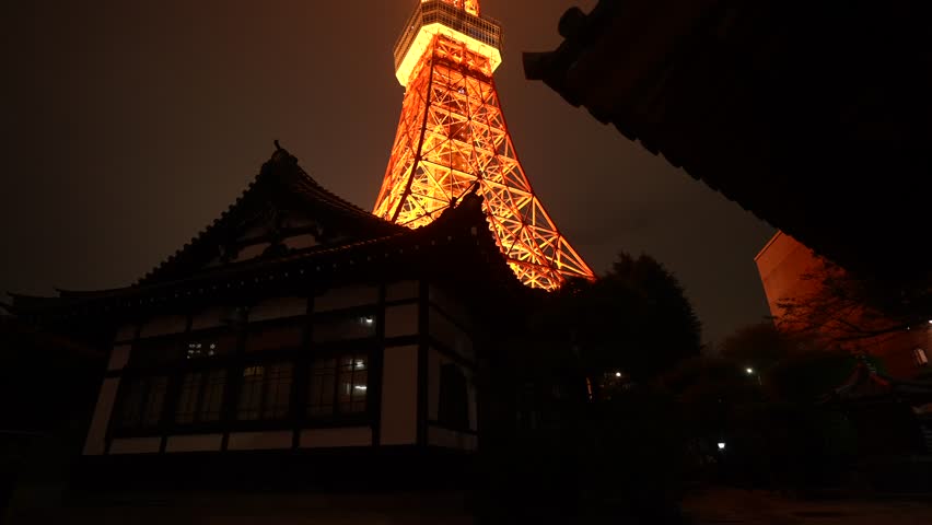 View of Tokyo Tower and Rurikoji Buddhist Temple at night in Minato City, Tokyo, Honshu, Japan