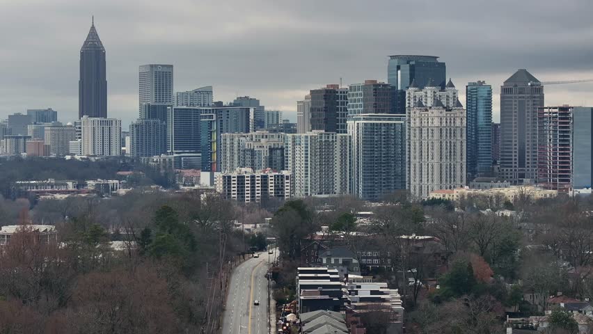 Reverse reveal of Atlanta skyline on a cloudy day