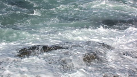 Ocean Water Splashing on Rocks