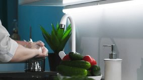 hand care and cleanliness, young woman washes her hands with soap foam background of a tap with water in a sink in kitchen, close-up - Powered by Shutterstock - Get 15% off with code: PIKWIZARD15
