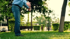 Grandfather and grandson playing together in summer park. Child playing with grandfather run and hugging him. Happy grandson loves his grandfather. Family walk in park with child. Family relationships - Powered by Shutterstock - Get 15% off with code: PIKWIZARD15