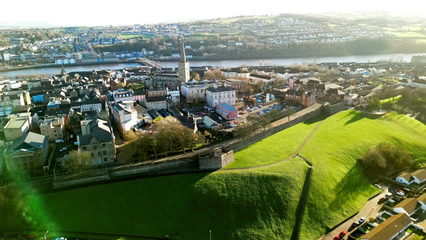 Ultra wide aerial of The Derry Walls in Derry-Londonderry, Northern Ireland on a bright sunny day. Filmed in 4K at 30fps with Rec709 color.