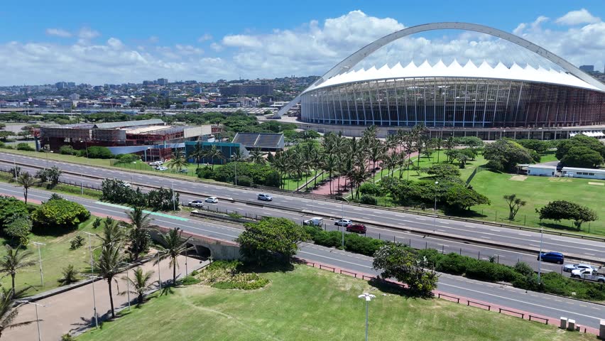 Aerial Footage of Durban Coastline Showcasing Cityscape Elements on a Bright Sunny Day