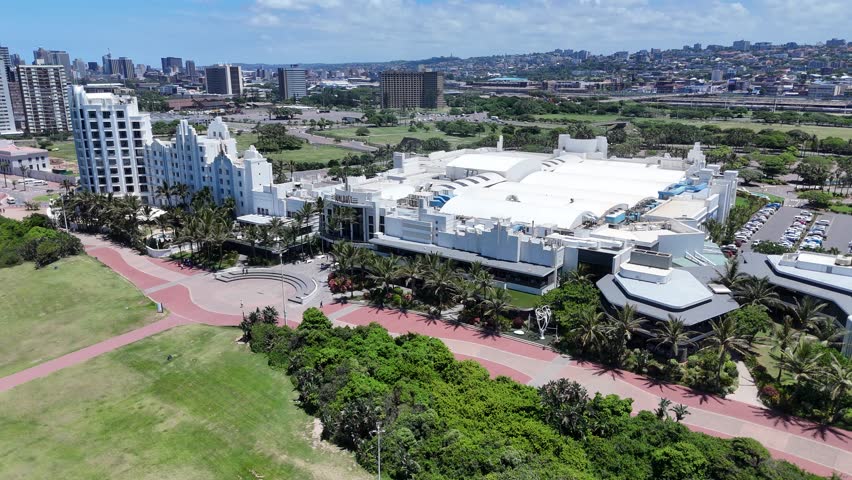 Aerial Footage of Durban Coastline Showcasing Cityscape Elements on a Bright Sunny Day