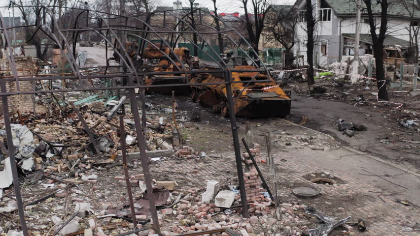 Drone footage of a famous street in Bucha, Ukraine, lined with destroyed Russian military vehicles after the withdrawal of Russian forces.
