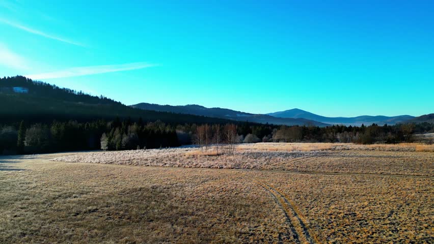Landscape of Beskid mountains during sunny winter morning - aerial 4k