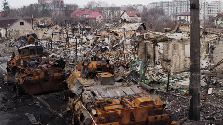 Drone footage of a famous street in Bucha, Ukraine, lined with destroyed Russian military vehicles after the withdrawal of Russian forces.