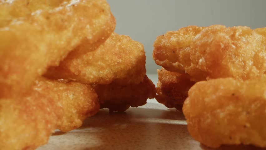 Fast food delivery meals chicken nuggets and fried chicken fish and chips ready to takeaway. Fat American cuisine macro close up restaurant..