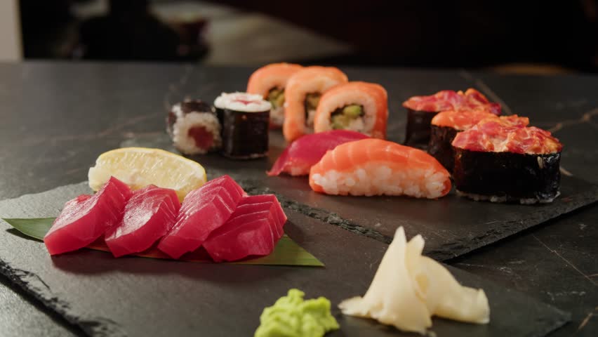 Sushi Sashimi Nigiri Platter, japanese gunkan maki sushi restaurant, Fresh Tuna and Salmon Slices in modern cafe, traditional food, raw red fish dish, omega 3.
