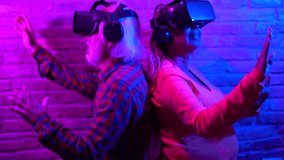 Multiracial senior couple having fun using 3d metaverse goggles indoor - Elderly people and augmented reality technology concept  - Powered by Shutterstock - Get 15% off with code: PIKWIZARD15