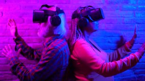Multiracial senior couple having fun using 3d metaverse goggles indoor - Elderly people and augmented reality technology concept  - Powered by Shutterstock - Get 15% off with code: PIKWIZARD15