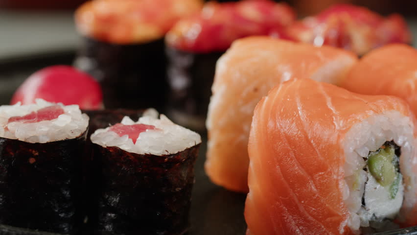 Sushi Sashimi Nigiri Platter, japanese gunkan maki sushi restaurant, Fresh Tuna and Salmon Slices in modern cafe, traditional food, raw red fish dish, omega 3.