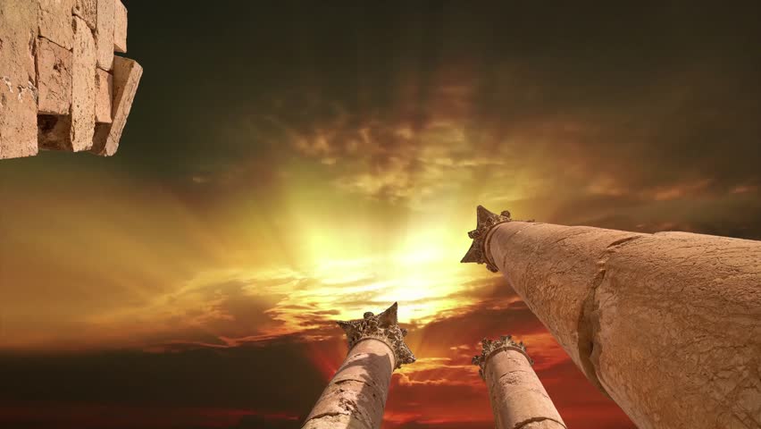 Roman Columns in the Jordanian city of Jerash (Gerasa of Antiquity), capital and largest city of Jerash Governorate, Jordan. Against the background of the sunset. 4K, time lapse, with zoom   