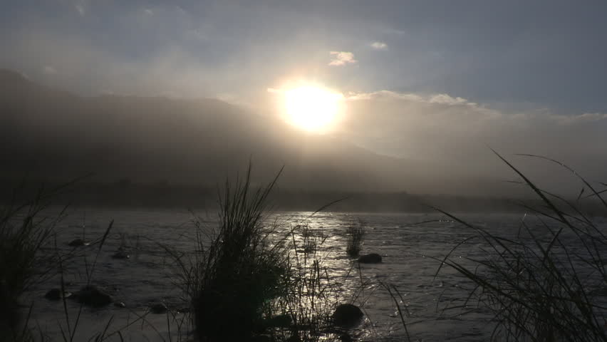 A timelapse of Umkomaas river and sun .