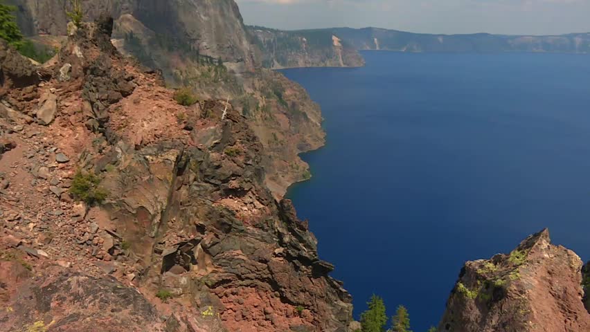Tilt-up view of Crater Lake revealing ridges, crater summit, and volcanic landscape. USA