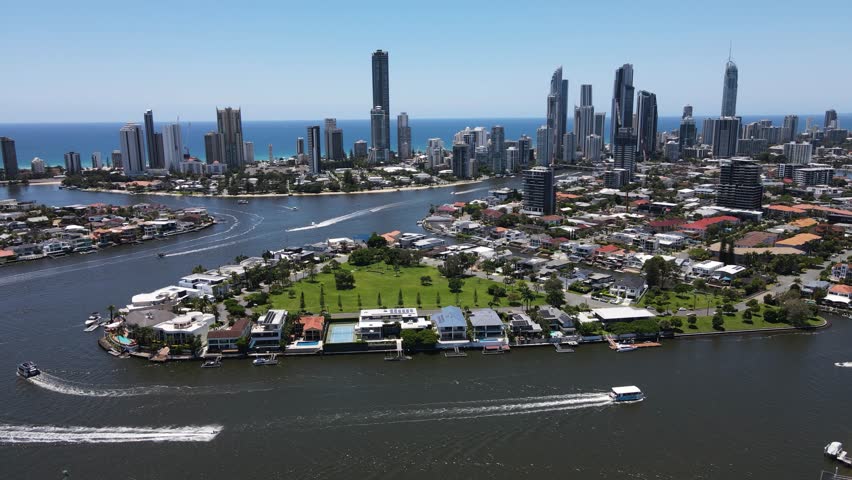 Gold Coast canal waterways and the iconic towering urban skyline of the popular holiday destination Surfers Paradise. Creative drone view