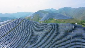 Huge solar panel farm nestled on the lush Taihang Mountain slopes, showcasing renewable energy innovation. China, Loess Plateau. - Powered by Shutterstock - Get 15% off with code: PIKWIZARD15