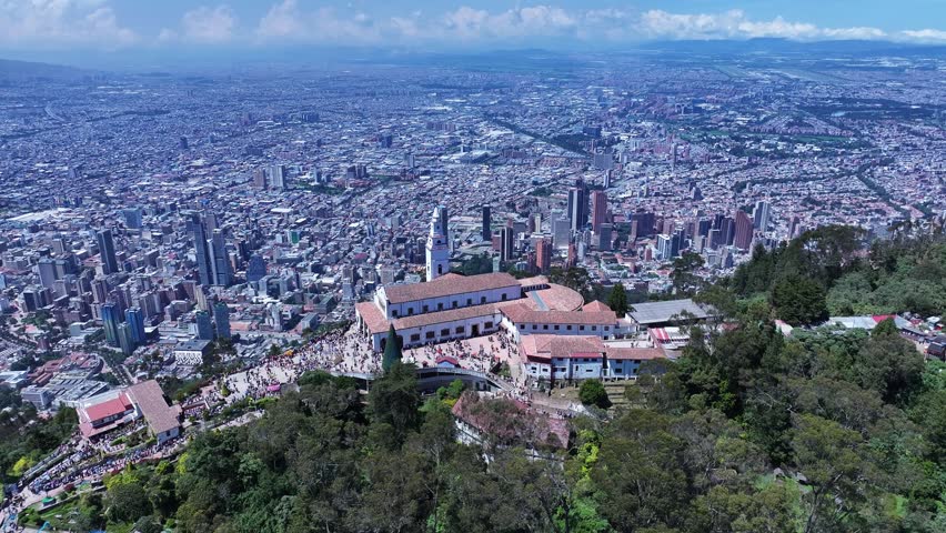 Monserrate Church At Bogota District Capital Colombia. Aerial View Of Church Building Dominating The Skyline. Business Sky Background Downtown Cityscape. Exterior Downtown Panoramic City.