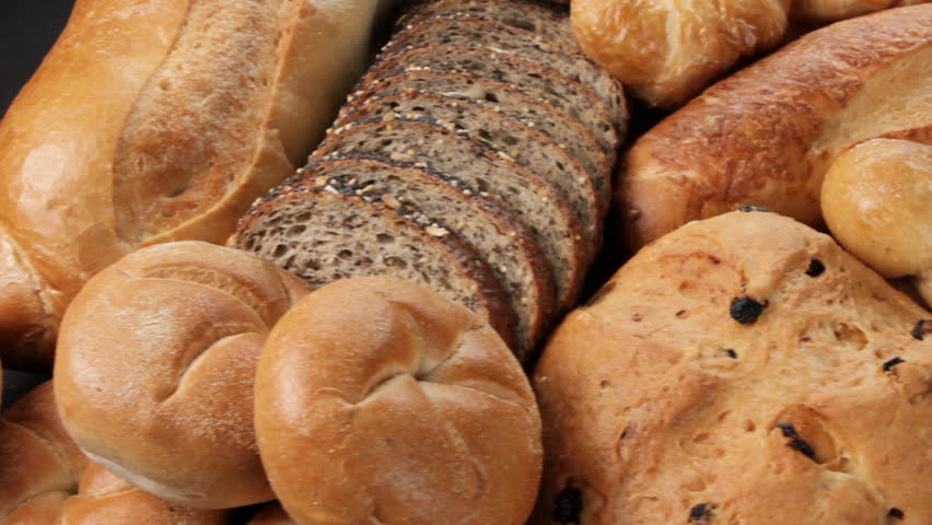 Breads and baked goods: Camera pans across large assortment in HD video